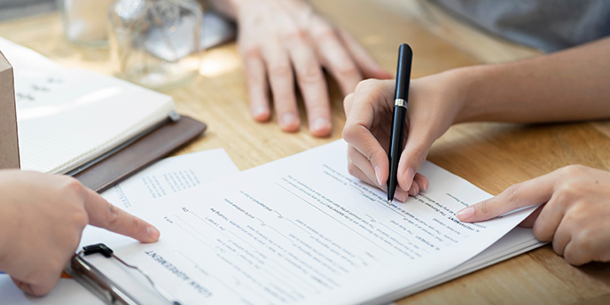 Hand Signing Papers